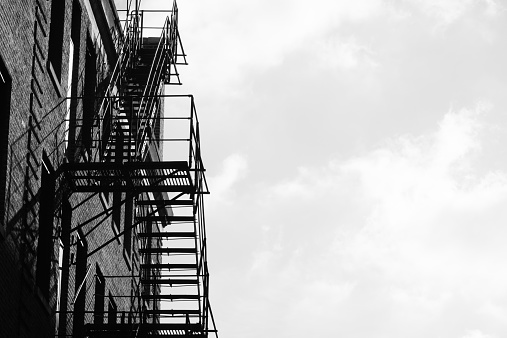 A monochromatic image of a fire escape in downtown Chicago.