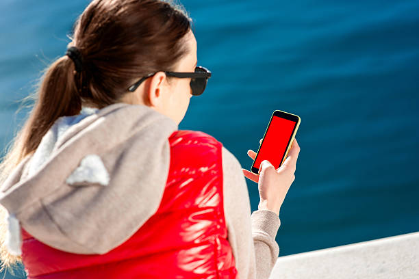 sport frau auf die promenade - women sweater vest beach pier stock-fotos und bilder