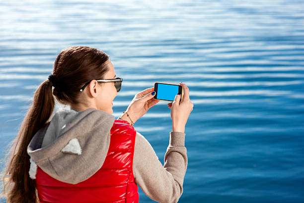 sport frau auf die promenade - women sweater vest beach pier stock-fotos und bilder