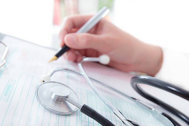 istock Doctor writing a prescription on medical exam 466610909