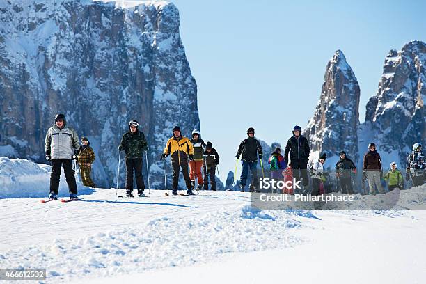 Group Of Winter Sports Tourists Alpine Skiing On Seiser Alm Stock Photo - Download Image Now