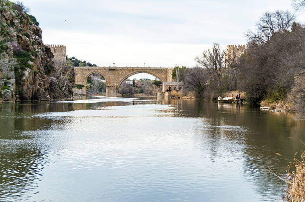 Toledo, Spain - February 28. 2015: Bridge medieval San Martin in Toledo seen from the Tagus river. Built in the thirteenth century