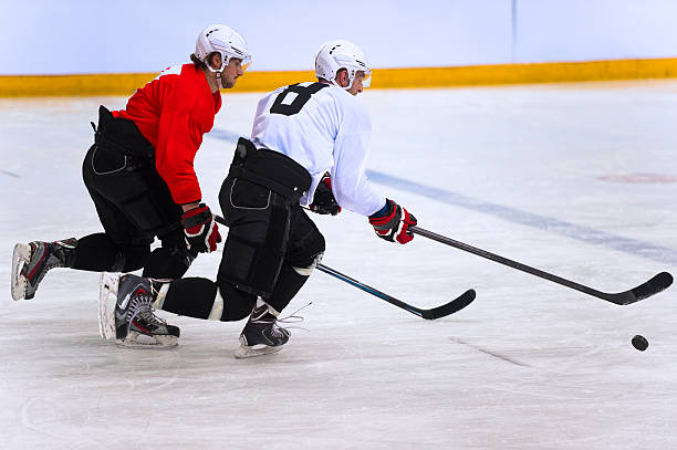 istock Two Ice Hockey Players Duelling 466614849