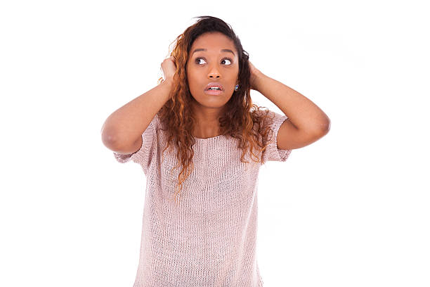 istock Worried young african american holding her head isolated on whit 466625848