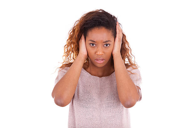 istock young african american covering her ears with her hands isolated 466625850