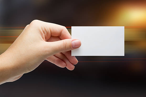 istock Hand holding white business card on blurred background 466630530