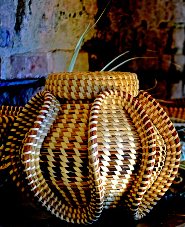 Woven Sweetgrass Basket in the low light of slave quarters on a South Carolina Plantation