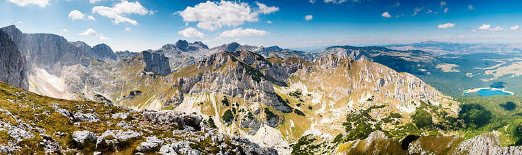 Durmitor mountain range with Bobotov Kuk, the highest point of masif, as well as other major peeks and valleys, Crno Jezero and other lakes. Also, The Glacier, named \