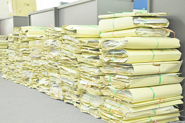 istock Stack Of Tied Old Files Yellowing On Office Floor 466634202