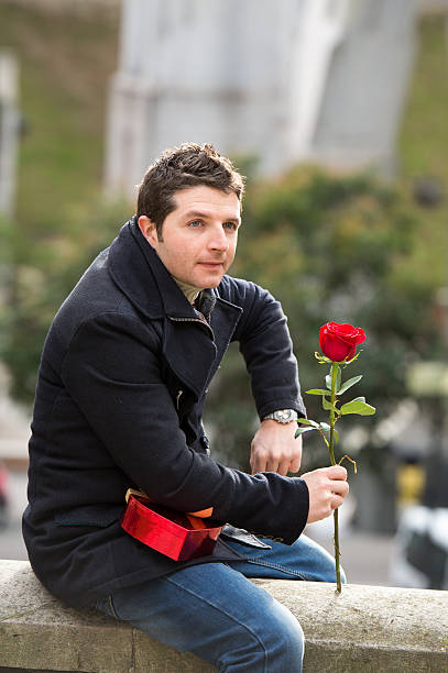 istock man with chocolates and a rose being stood up 466640499
