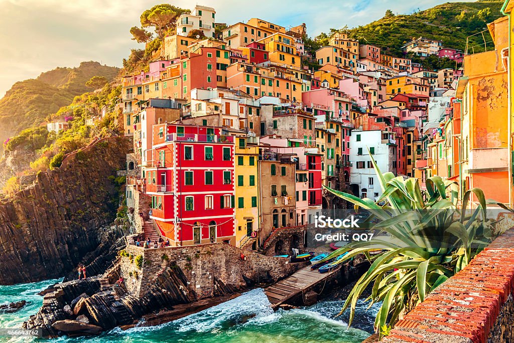 City in Italy with buildings on the coast Riomaggiore at sunset, Cinque Terre National Park, Liguria, La Spezia, Italy Cinque Terre Stock Photo