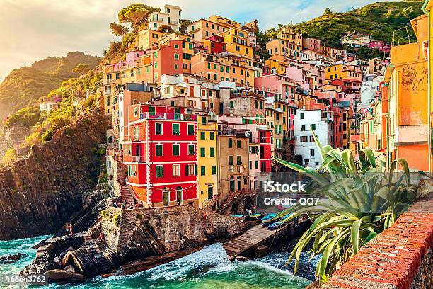 City In Italy With Buildings On The Coast Stock Photo - Download Image Now - Cinque Terre, Riomaggiore, Liguria