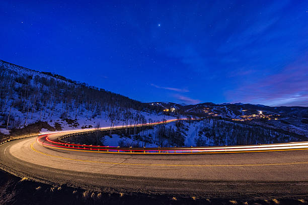 istock Mountain Road at Dusk with Vehicle Lights 466648534