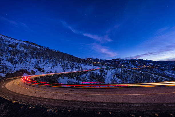 istock Mountain Road at Dusk with Vehicle Lights 466648688