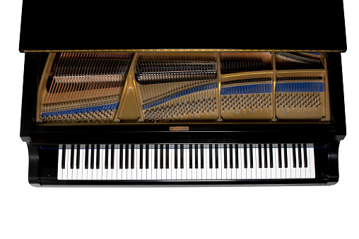 Grand piano.  Close up showing keys, harp, and hammers.  Viewed from above.  Isolated on white.