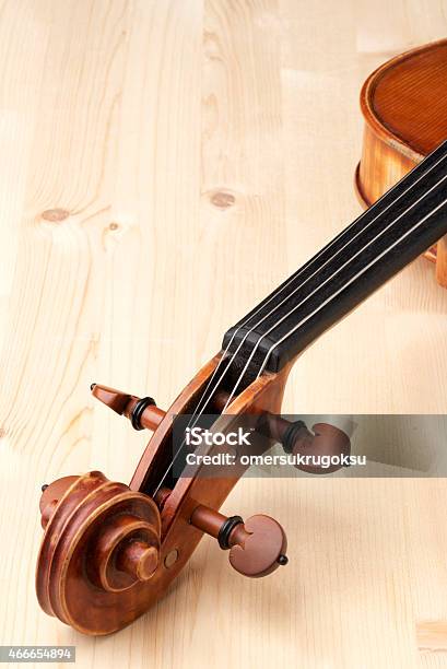 Closeup Of Violin Family On Wooden Background Stock Photo - Download Image Now - 2015, Antique, Art And Craft