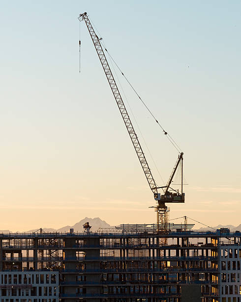 Construction Crane at Sunset stock photo
