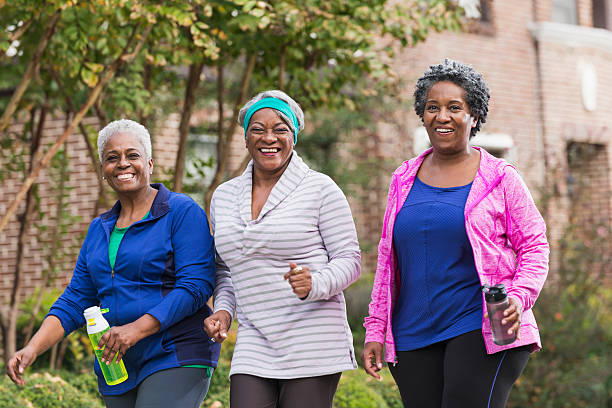 três preto de idosos mulher exercitar em conjunto - walking exercising relaxation exercise group of people imagens e fotografias de stock