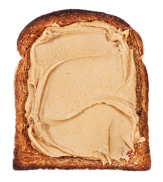 istock Peanut butter on toast isolated on white 466657086