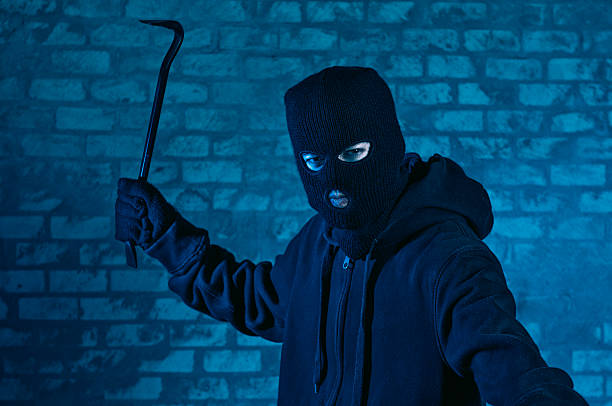 istock Burglar with mask attacks with a crowbar 466657270