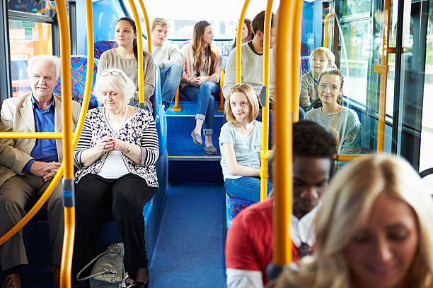 interno dell'autobus con passeggeri - bus transportation indoors people foto e immagini stock