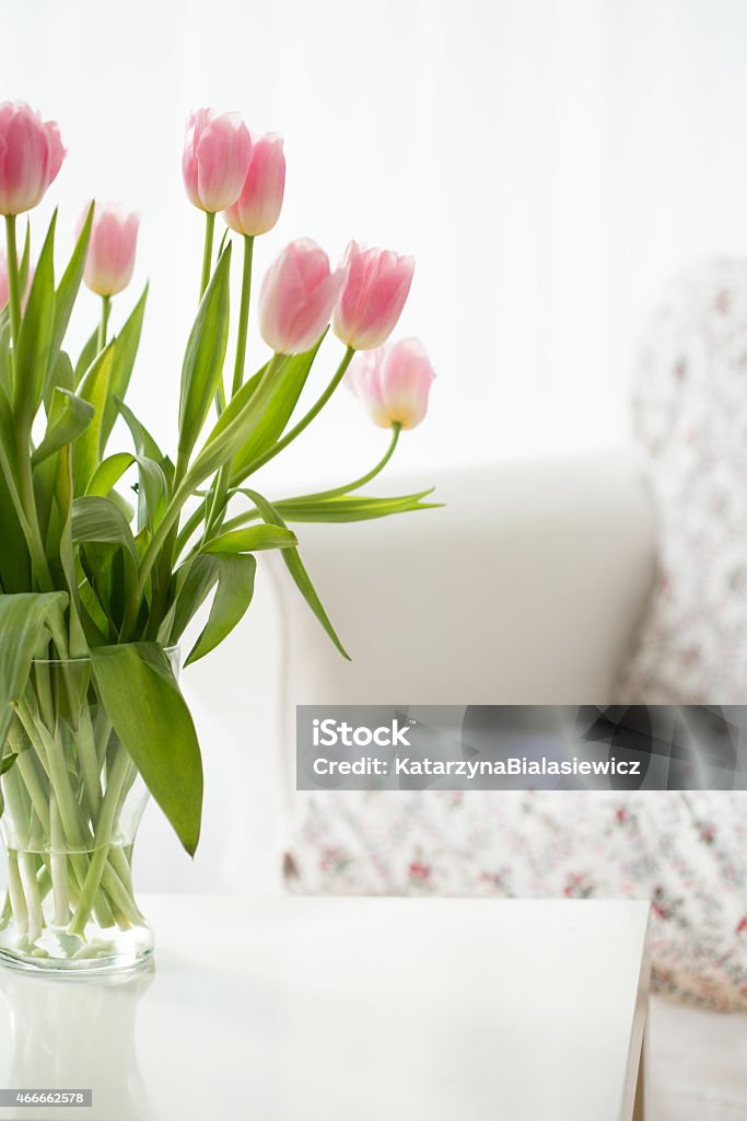 Flowers in a vase Beautiful fresh flowers in a vase on a table Lighting Equipment Stock Photo