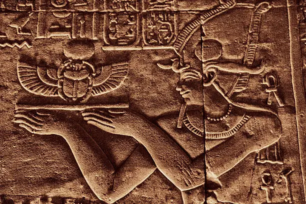 Ancient Hieroglyphics - Egyptian Priest Carrying a Tray with Scarab.