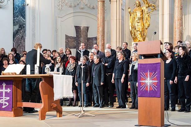 Church choir during worship service Ludwigsburg, Germany - March 8, 2015: The church choir The Voices Of Peace perform during the worship service in the Friedenskirche - Peace Church - on March 8, 2015 in Ludwigsburg, Germany.  ludwigsburg photos stock pictures, royalty-free photos & images