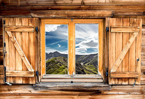 Mountain view from the window of a cabin on a mountaintop 