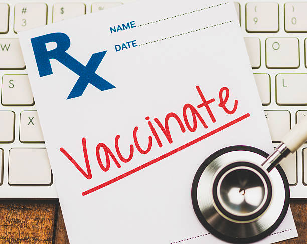 istock Doctor's Orders. Prescription form reading Vaccinate. Medical concepts. 466668552