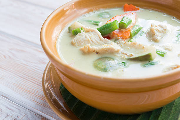 Close up Thai green curry intense soup with chicken stock photo