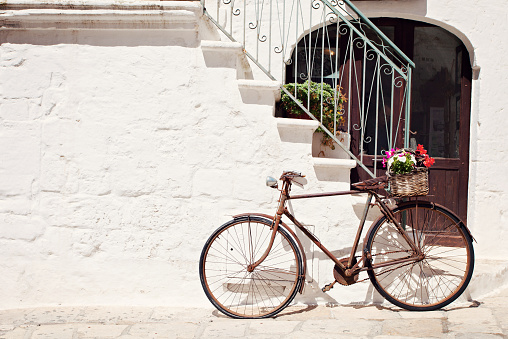 An Italian old style bicycle by the steps