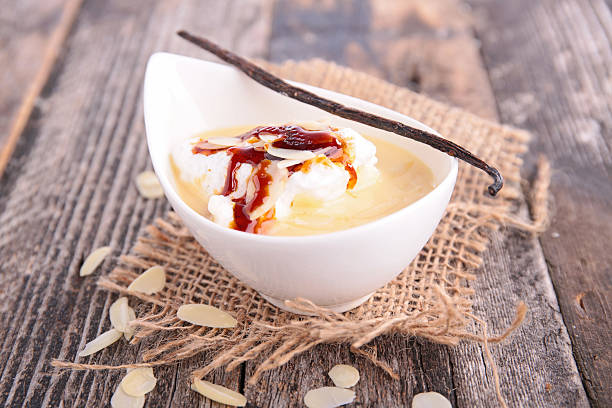 istock White bowl with Floating Island dessert with vanilla pod 466675642