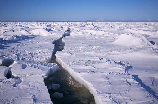 Arctic cold sea, solid ice landscape with crack