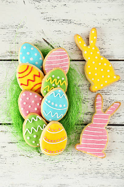 istock Colorful easter cookies on white wooden background 466675964