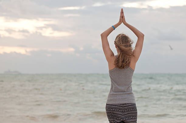 istock Woman is doing yoga exercises 466676942