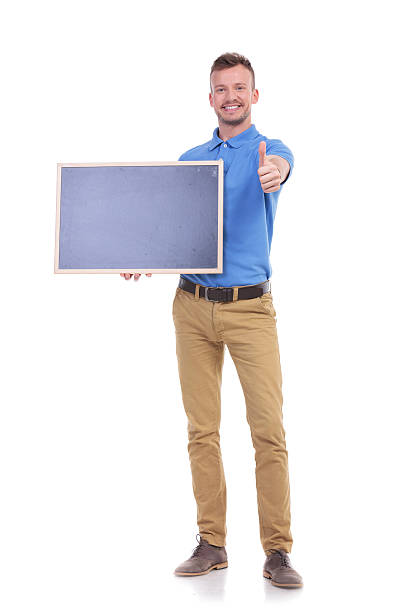 istock casual young man with blackboard shows thumb up 466676964
