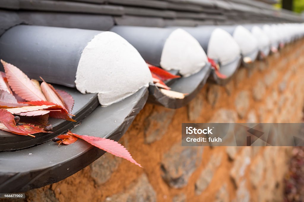 Grunge stone and clay wall in autumn. Autumn leaves on the grunge stone and clay wall. 2015 Stock Photo