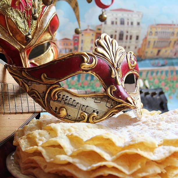 Carnival mask Beautiful carnival mask with music and Venice in the backgrund and some pancakes . troubadour stock pictures, royalty-free photos & images