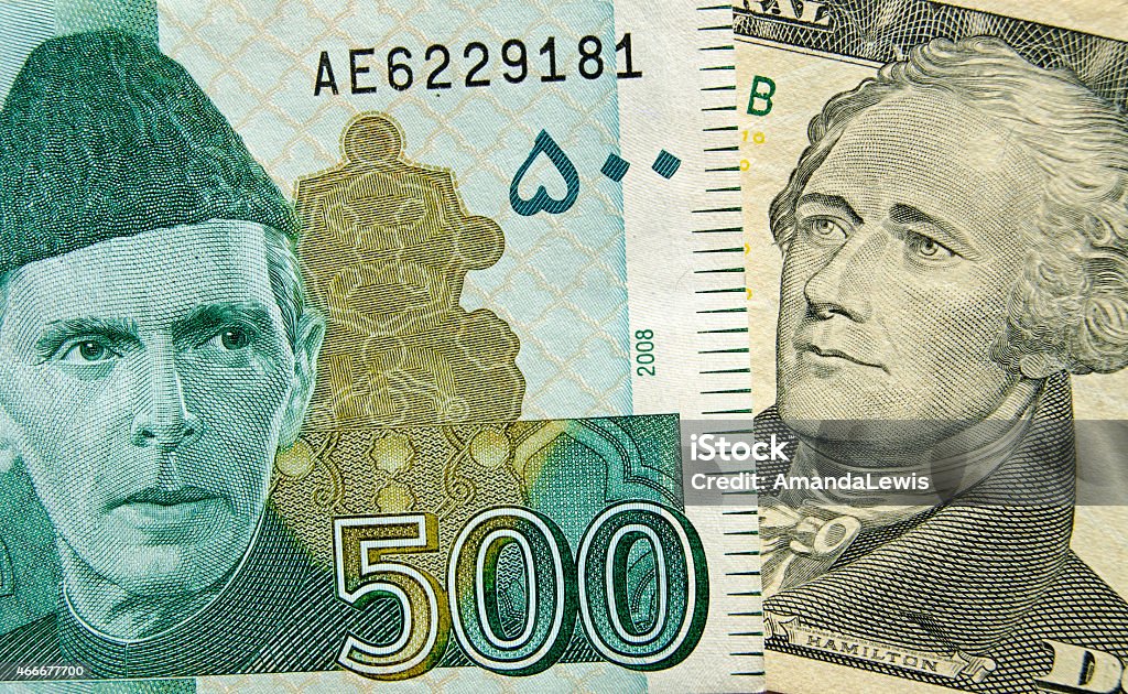 Pakistan and US Banknotes Banknotes showing the founding fathers of their respective countries  The Pakistan 500 rupee showing Muhammad Ali Jinnah and 10 dollar bill showing Alexander Hamilton, one of the US founding fathers.   Indian Currency Stock Photo