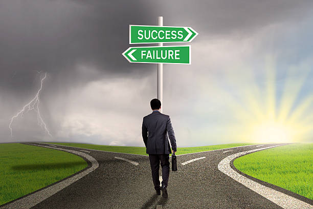 istock Entrepreneur with signpost to success or failure 466678124