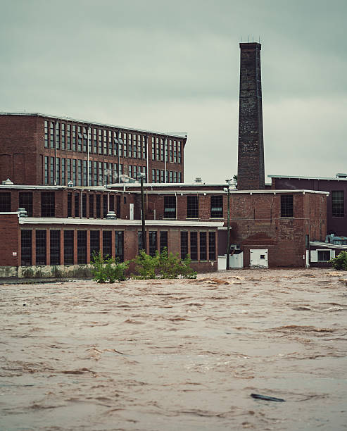 water flood natural seasonal disaster strong stream broken dam rustic country side depressive and ugly third world region aerial dark photography view