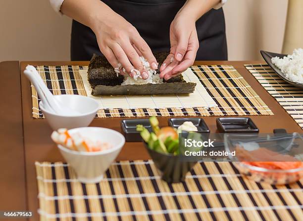 Woman Chef Filling Japanese Sushi Rolls With Rice Stock Photo - Download Image Now - Adult, Asia, Asian Culture