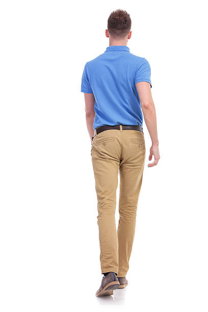 istock casual young man walks away from camera 466680360