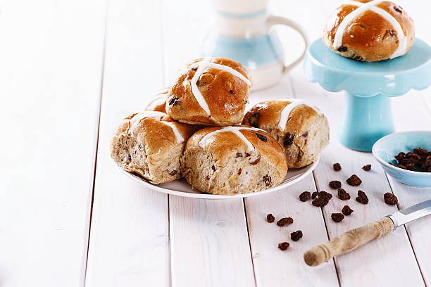 istock Easter cross-buns on a white wooden background 466680732