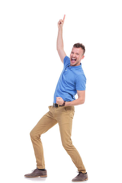 istock casual young man cheers and points up 466681608