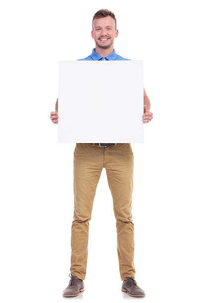istock casual young man holds blank board 466681630