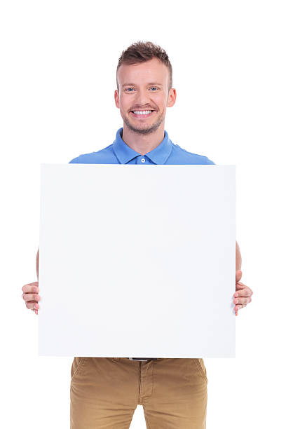 istock casual young man shows his blank board 466681632