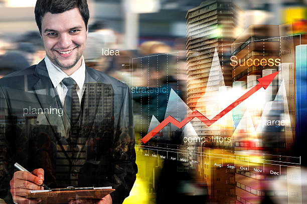 businessman working with computer graph stock photo