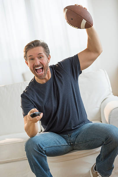 istock Man watching football getting excited 466683553